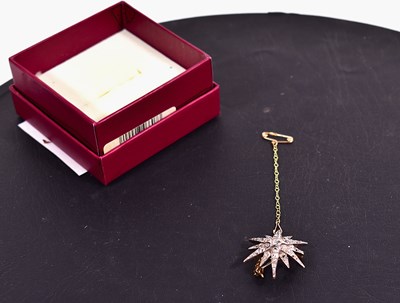 Lot 115 - An antique old mine cut diamond starburst...