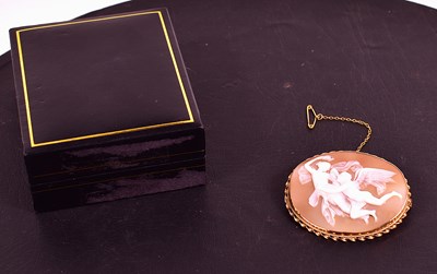 Lot 96 - A yellow metal cameo brooch depicting winged...