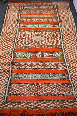 Lot 599 - A Middle Eastern handwoven wool kilim rug with...