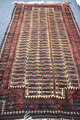 Lot 600 - A Middle Eastern wool rug, camel ground with...