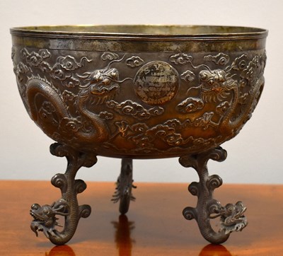 Lot 181 - A white metal Shanghai footed dragon punch...