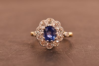 Lot 133 - An 18ct gold, platinum, diamond and sapphire...