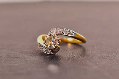 Lot 134 - An 18ct gold and diamond 'swirl' ring, the...