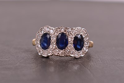 Lot 110 - An 18ct gold, diamond and sapphire ring, the...